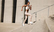 © Jacob Lund - Fit woman running up the steps