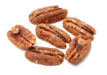 Peeled pecan nuts closeup, isolated on white background