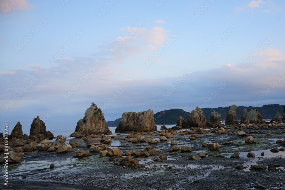 Hashikuiiwa Rocks in a row towering over the seashore from Kushimoto ...