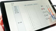 © Jessica - Work performance appraisal (evaluation) is reported on the tablet PC. Employment concept. Translation:Department, Period, Task, Draftsman, Manager, Evaluation Subject, Factor, Score, Rating categories