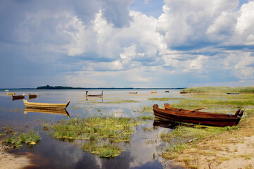 Fishing boat on the shore on lake