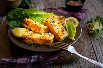 Wall Mural - Cooked fish fillet with lemon and vegetables