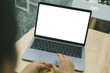 © panitan - computer screen blank mockup.hand woman work using laptop with white background for advertising,contact business search information on desk at coffee shop.marketing and creative design