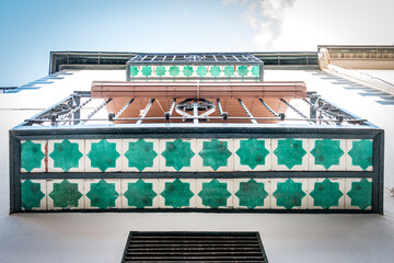 facade of a building in the city of granada, azulejos, balcony, tiles