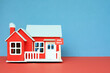 © dean - For sale sign attached to a scale model house. Housing market concept.