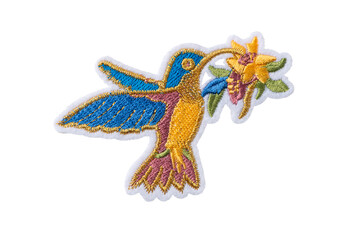 Colorful hummingbird with flower embroidered patch isolated on white background