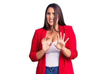 Sticker - Young beautiful brunette woman wearing elegant clothes disgusted expression, displeased and fearful doing disgust face because aversion reaction. with hands raised