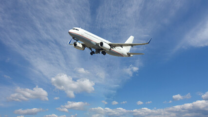 Zoom photo of latest technology passenger airplane flying in deep blue  slightly cloudy sky