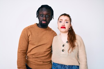 Sticker - Interracial couple wearing casual clothes depressed and worry for distress, crying angry and afraid. sad expression.