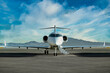 © bruno - private jet airplane at the airport with clouds