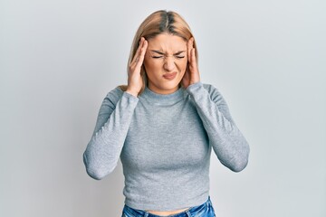 Young caucasian woman wearing casual clothes with hand on head for pain in head because stress. suffering migraine.