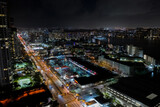 Fototapeta Londyn - Shopping plaza strip mall night aerial photo