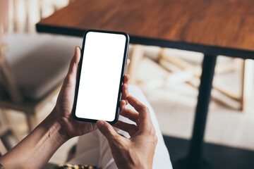 cell phone blank white screen mockup.woman hand holding texting using mobile on desk at office.background empty space for advertise.work people contact marketing business,technology