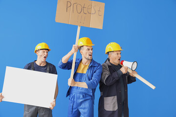 Wall Mural - Protesting miner men with placards on color background