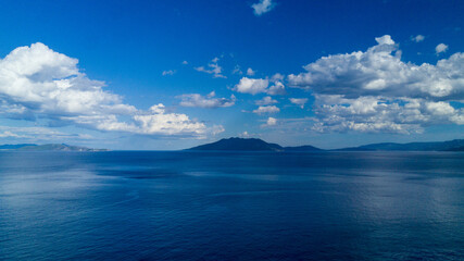 Wall Mural - blue sky and clouds from drone in greece