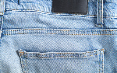 Wall Mural - Blue jeans back pocket. Closeup