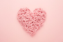 Valentines Day Heart Made Of Yarn On Pink Background. Copy Space, Flat Lay. Compound Love Symbol.