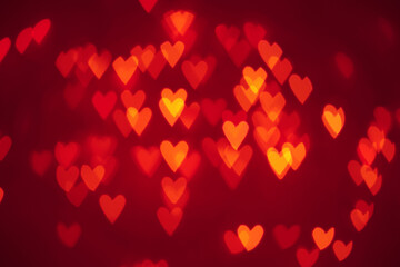 Abstract holiday background for valentines day with hearts, festive background with blurred lights