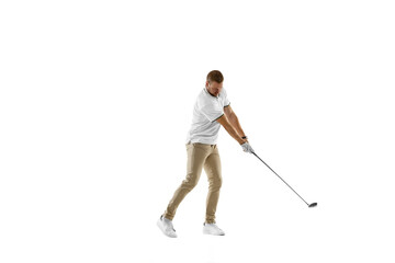 Wall Mural - Concentrated. Golf player in a white shirt taking a swing isolated on white studio background with copyspace. Professional player practicing with bright emotions and facial expression. Sport concept.