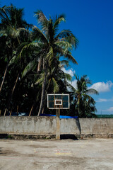 Basketball court between palm trees in the Philippines