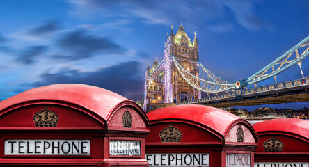Wall Mural - London symbols with Tower bridge against red phone boots in England, UK