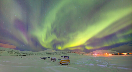 Wall Mural - aurora borealis or northern lights in the sky over tromso, norway