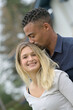 © goodluz - Portrait of young loving couple embracing each other, mixed ethnicity