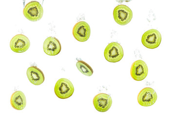 Wall Mural - Pattern with kiwi slices sinking in water against white background