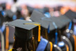 © atsarapong - Graduation cap image from the back of graduates Graduates attending the university graduation ceremony