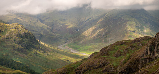  Lake district panorama of the beautiful Langdale valley, with walkers on a distant ridge