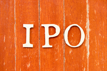 Poster - Alphabet letter in word IPO (Abbreviation of Initial Public Offering) on old red color wood plate background