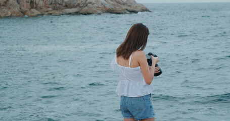 Canvas Print - Woman take photo on camera for the sea view