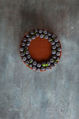 Canvas Print - Chocolate brown cheesecake with fresh blueberries on vintage concrete background.