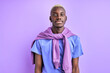 © alfa27 - african guy in casual shirt posing at camera isolated over purple background, calm