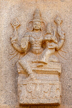 Hampi, Karnataka, India - November 4, 2013: Hazara Rama Temple. Closeup Of Beige Stone Sculptures Of Vishnu With Lakshmi On His Lap.