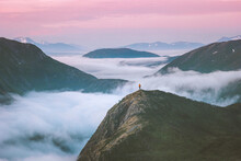 Traveler Hiking Above Mountain Clouds Enjoying Norway Sunset Landscape Travel Adventure Lifestyle Vacation Outdoor Epic Trip