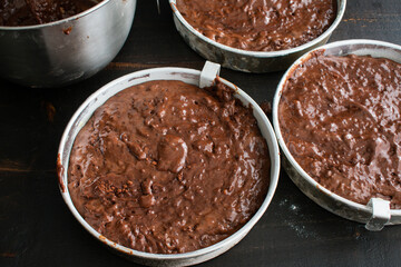 Canvas Print - Cake Pans Filled with Chocolate Batter: Three greased and floured aluminum cake pans filled with chocolate cake batter