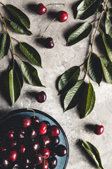 Wall Mural - Sweet organic berries on a light concrete background. Top view with copy space.