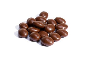 Poster - chocolate pills in heap isolated on white background