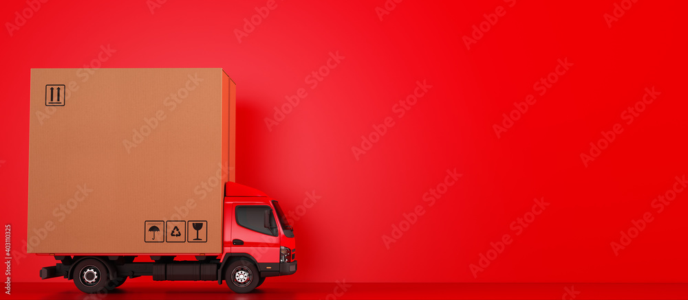 Big cardboard box package on a red truck ready to be delivered - obrazy, fototapety, plakaty 
