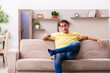 © Elnur - Young man student boring at home during pandemic