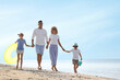© New Africa - Happy family at beach on sunny summer day
