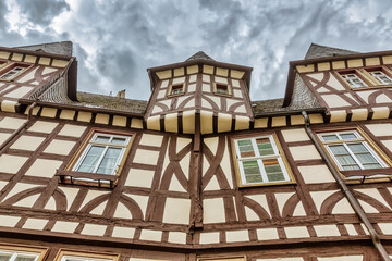 old half-timbered house with dark overcast sky