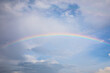 © chirawan_nt - View of beautiful blue sky with clouds and rainbow.