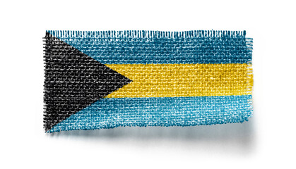 Bahamas flag on a piece of cloth on a white background