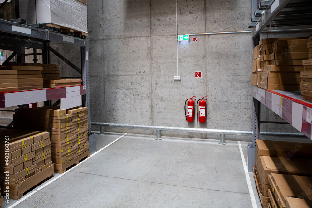 Fire extinguishers in the warehouse. Fire safety - obrazy, fototapety, plakaty 
