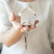 © Chinnapong - House key in landlord, real estate sale person or home Insurance broker agent hand giving to tenant, renter, buyer customer for new family owner, property assurance concept
