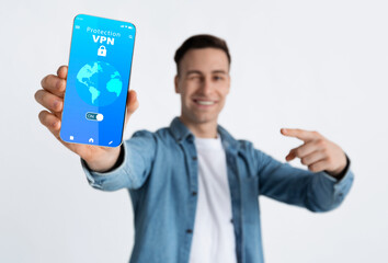 Poster - Smiling guy holding and showing smartphone with vpn app