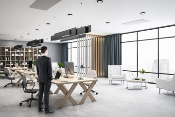 Aufkleber - Businessman standing in panoramic open space modern office