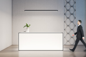 Aufkleber - Businessman walking in minimalistic office hall